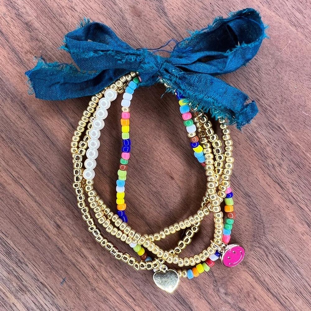 Seed bead bracelet stack!  Multi-color, smiley face, gold heart, pearl accent.